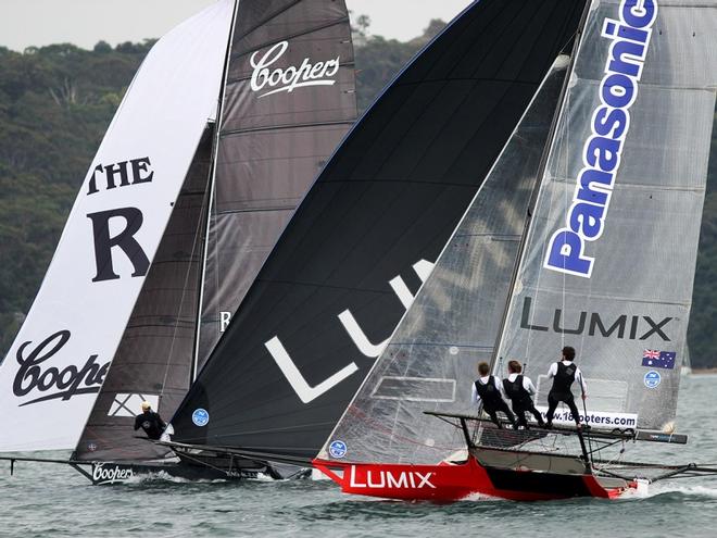 Panasonic Lumix and Coopers-Rag and Famish Hotel continued their battle downwind – 18ft Skiffs Spring Championship ©  Frank Quealey / Australian 18 Footers League